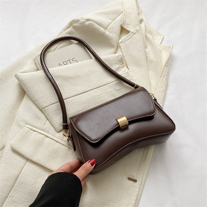Damen elegante Umhängetasche mit goldener Verschlussmechanik Nord Taschen