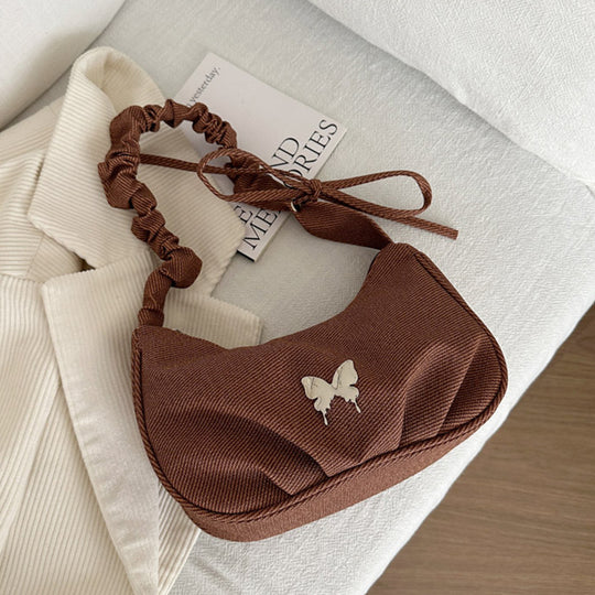 Damen Handtasche mit kreativer Faltentechnik und verspieltem Trageriemen Nord Taschen