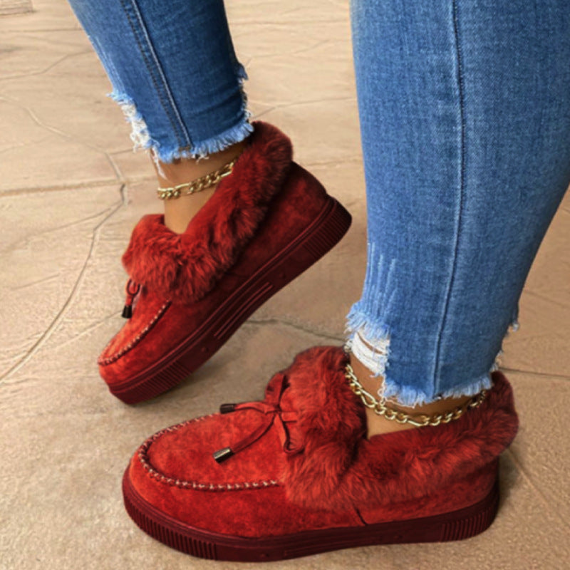 Damen Kuschel‑Mokassin‑Slipper mit hochfloriger Fellmanschette, dekorativer Steppnaht und leichtem Plateau‑Sohlenprofil Nord Taschen