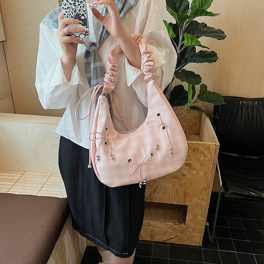 Damen Hobo-Tasche mit dekorativem Kordelzug und glänzenden Akzenten Nord Taschen