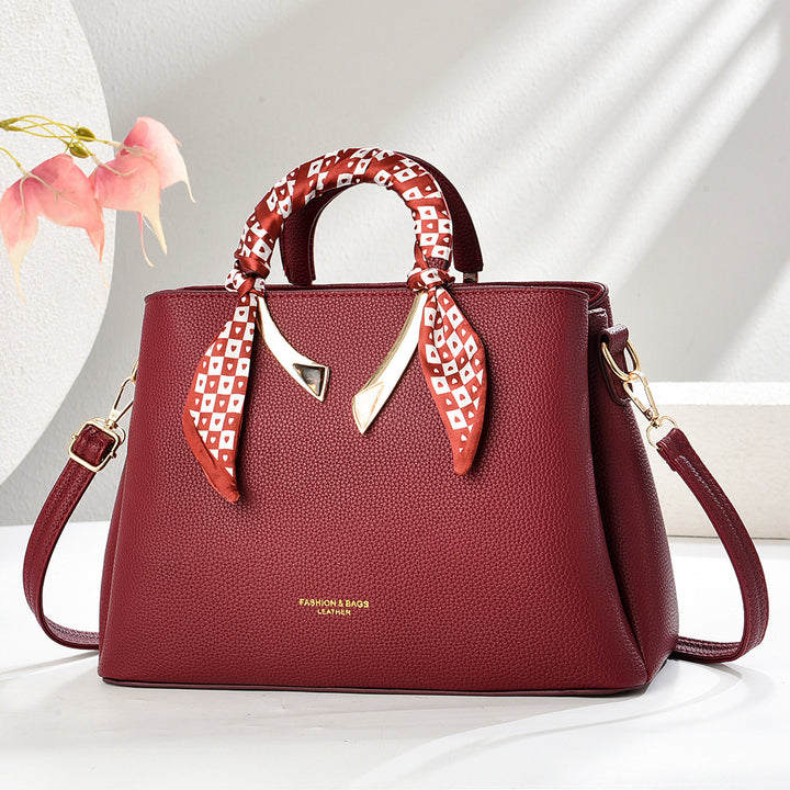 Damen elegante Handtasche mit dekorativer Schal-Applikation Nord Taschen