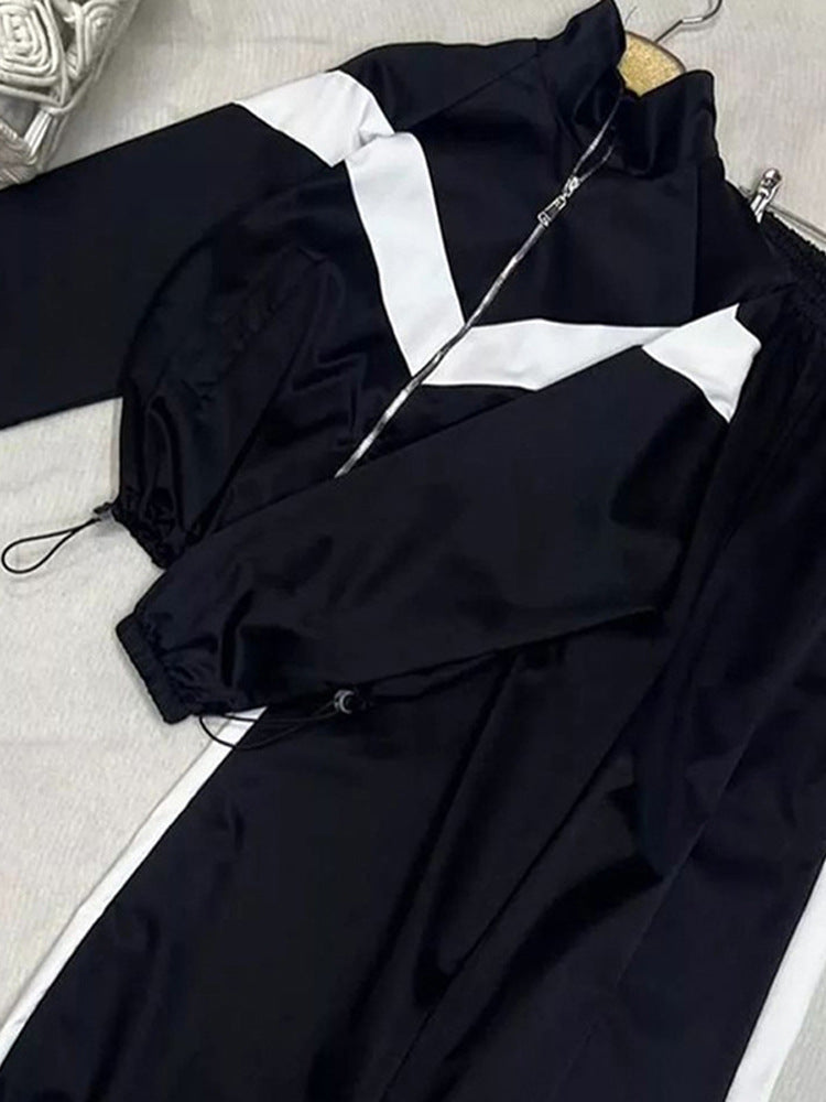 Damen Retro-Trainingsanzug mit Reißverschlussjacke und elastischer Bundhose Nord Taschen