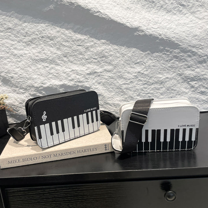 Damen Umhängetasche mit musikalischem Klaviertastendesign Nord Taschen