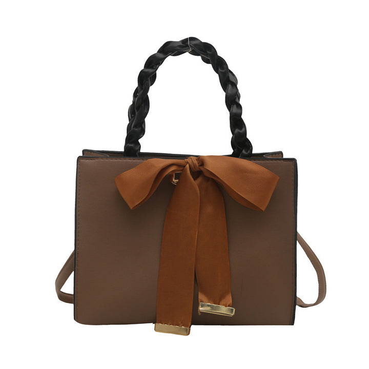 Damen elegante Handtasche mit geflochtenem Ledergriff und Schleifenakzent Nord Taschen