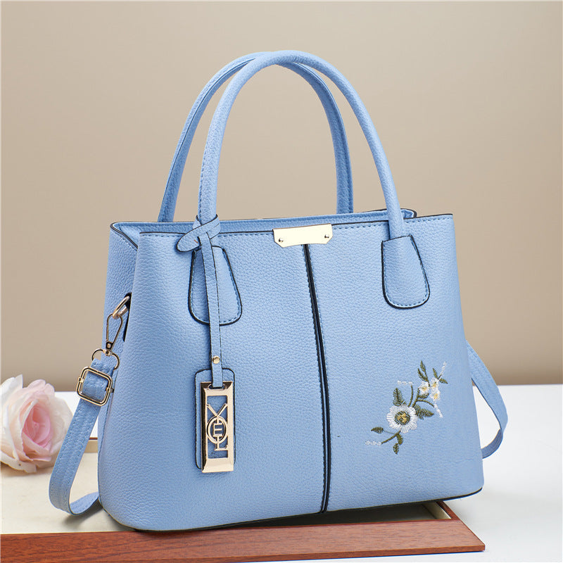 Damen Umhängetasche mit floralem Stickdesign und abnehmbarer Quaste Nord Taschen