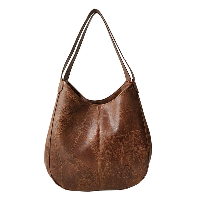 Damen Handtasche mit geschwungenem Design und hochwertiger Lederstruktur Nord Taschen