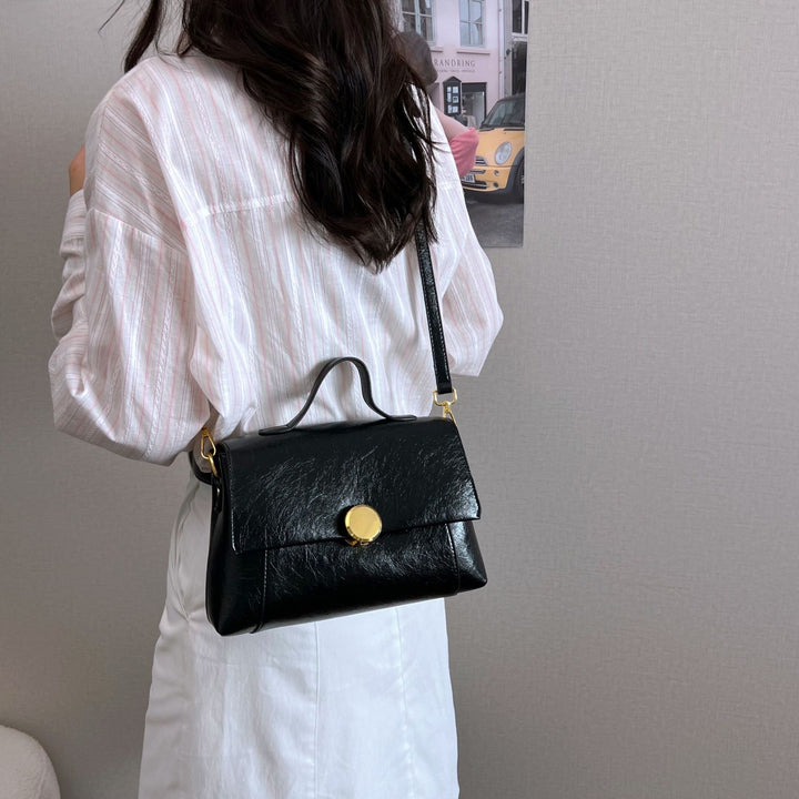 Damen elegante Handtasche mit praktischem Klappverschluss Nord Taschen