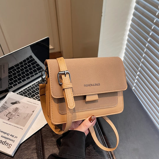 Damen Umhängetasche mit innovativem Klappverschluss und hochwertigen Akzenten Nord Taschen