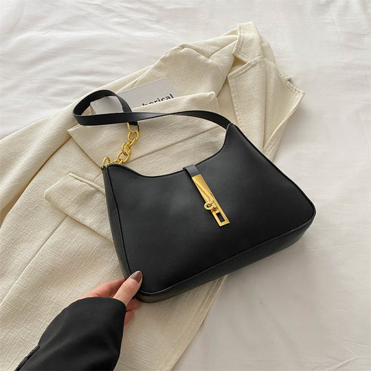 Damen Handtasche mit elegantem Kettenakzent und modernem Klappenverschluss Nord Taschen