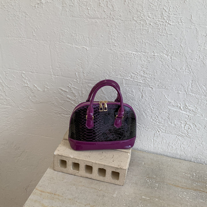Damen elegante Handtasche im stilvollen Schlangenleder-Look Nord Taschen