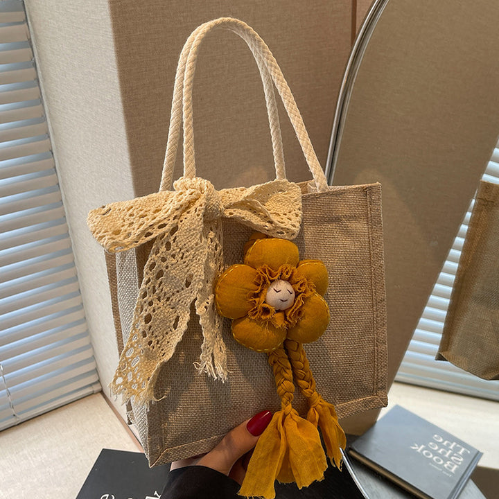 Damen Handtasche mit floralen Details und romantischem Bogen Nord Taschen