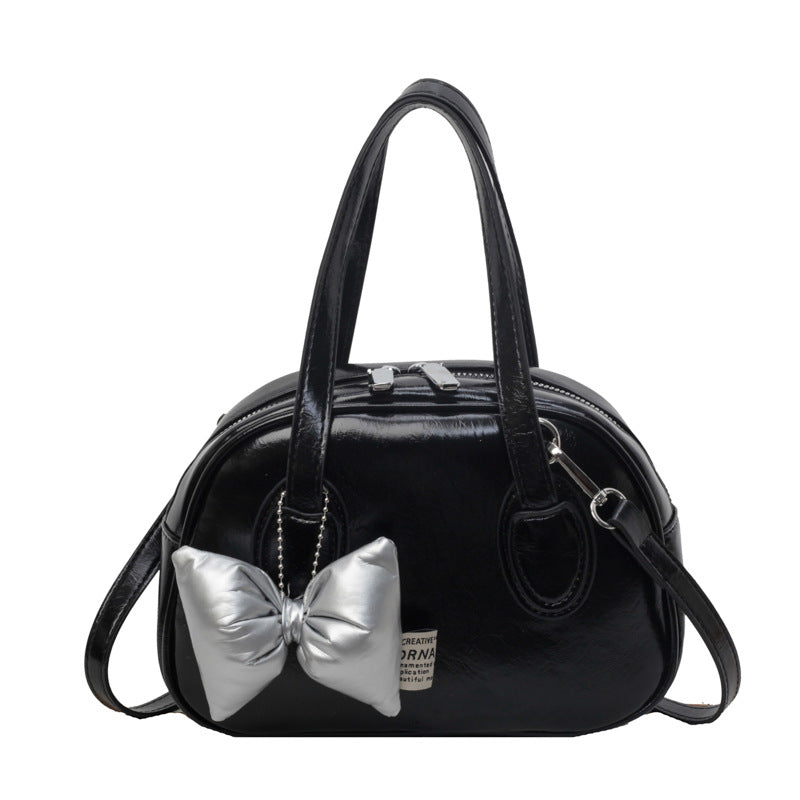 Damen Designer-Handtasche im verspielten Stil mit dekorativem Schleifen-Detail | Nord Taschen