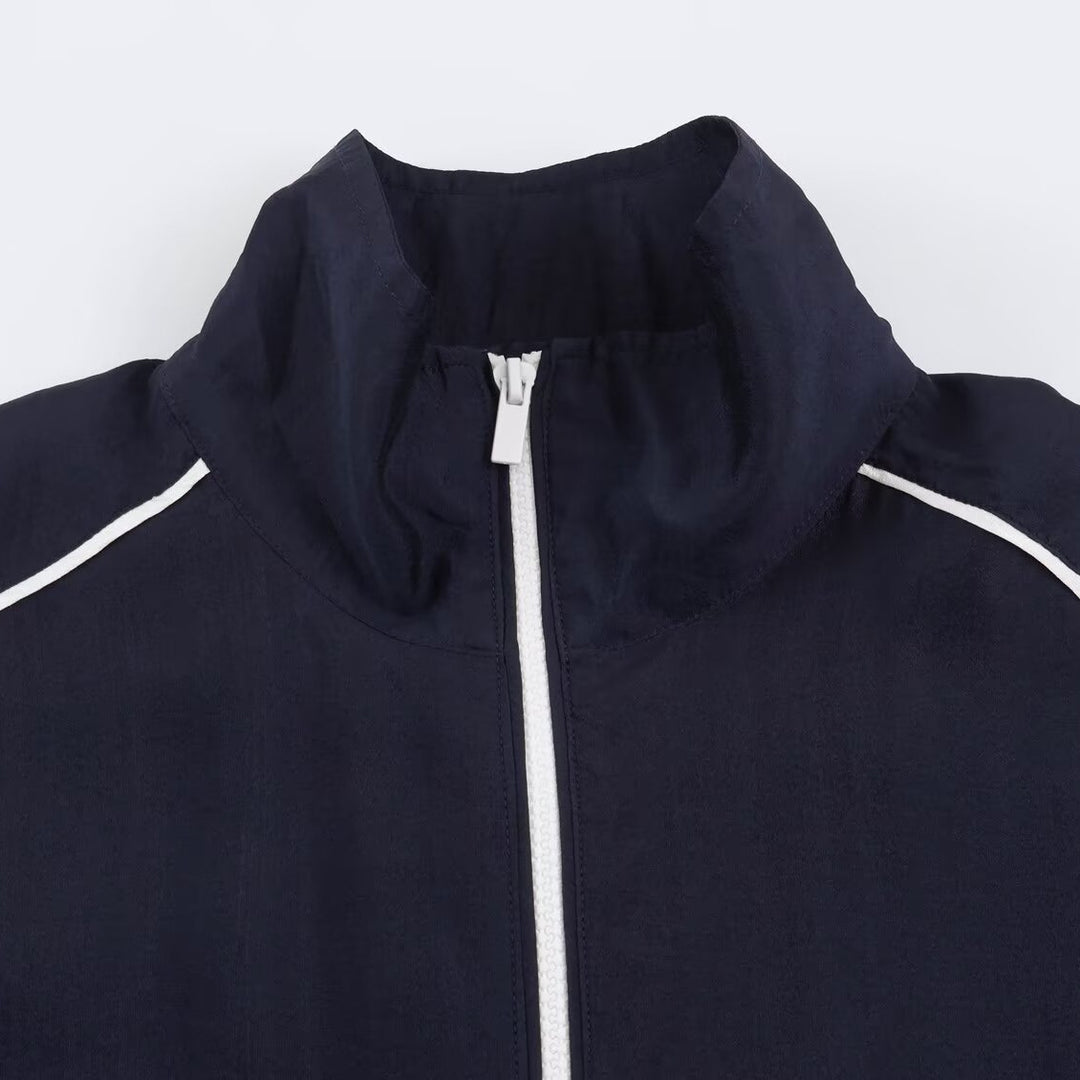 Damen Cropped Windbreaker-Jacke mit hohem Funnelkragen, Kontrastpaspel und elastischem Saum Nord Taschen