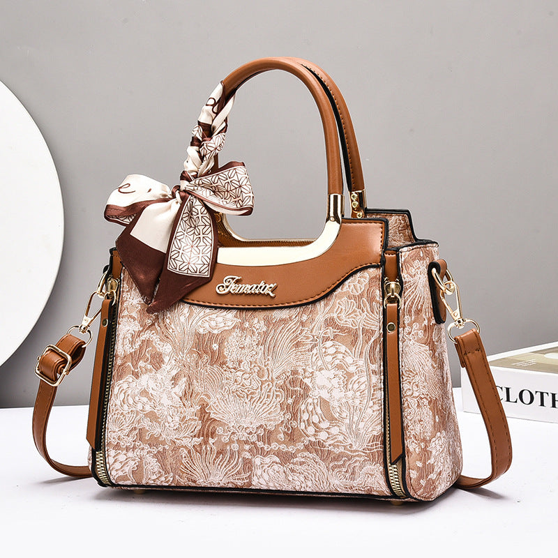 Damen elegante Handtasche mit floralem Design und Schmuckdetails Nord Taschen