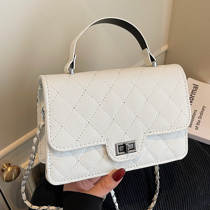 Damen Handtasche mit eleganter Steppung und schickem Metallverschluss Nord Taschen