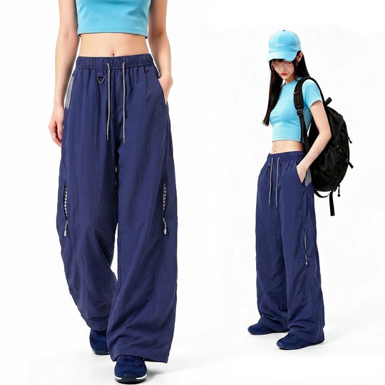 Damen Oversize Tech-Loungehose mit Kontrastnähten, reflektierenden Reißverschlusstaschen & Kordelbund Nord Taschen