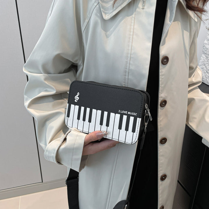 Damen Umhängetasche mit musikalischem Klaviertastendesign Nord Taschen