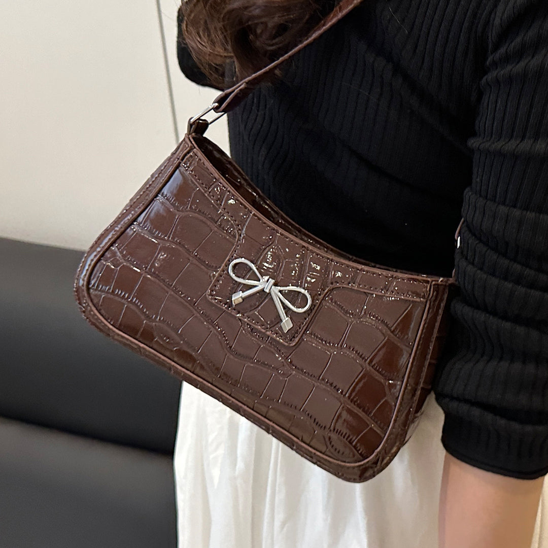 Damen elegante Handtasche mit Krokodilprägung und charmantem Schleifendetail Nord Taschen