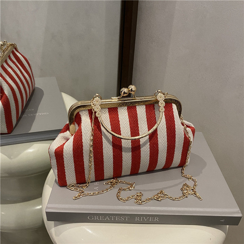 Damen Handtasche mit gestreiftem Design und goldenen Akzenten Nord Taschen