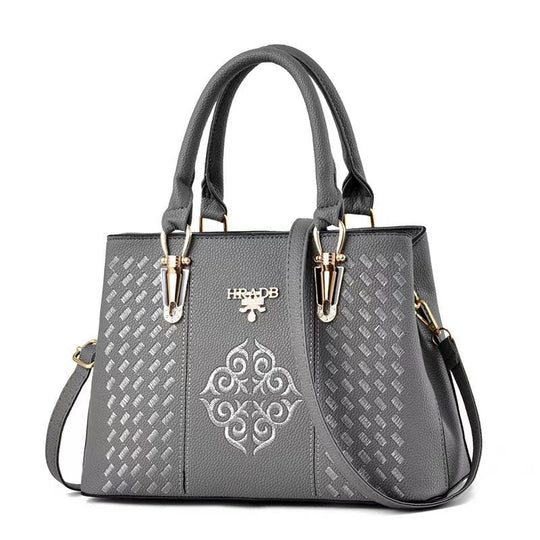 Damen elegante Handtasche mit aufwendigem gewebtem Design und kontrastierender Verzierung Nord Taschen