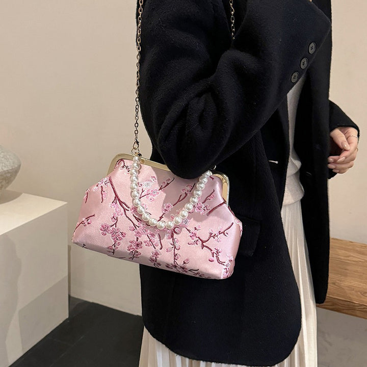 Damen elegante Clutch mit floralen Akzenten Nord Taschen