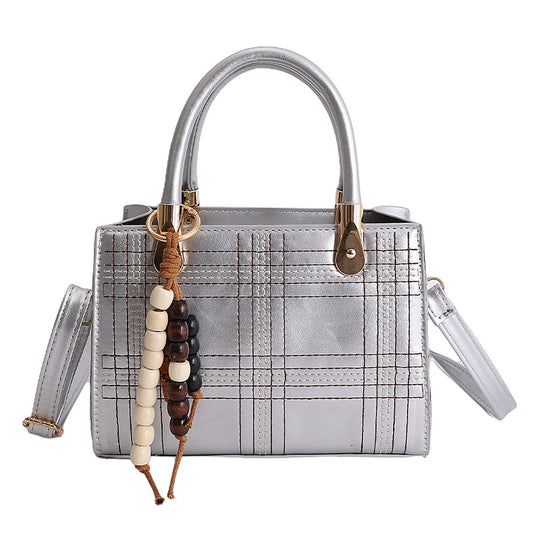 Damen Mini-Handtasche mit eleganter Struktur und goldenen Akzenten Nord Taschen