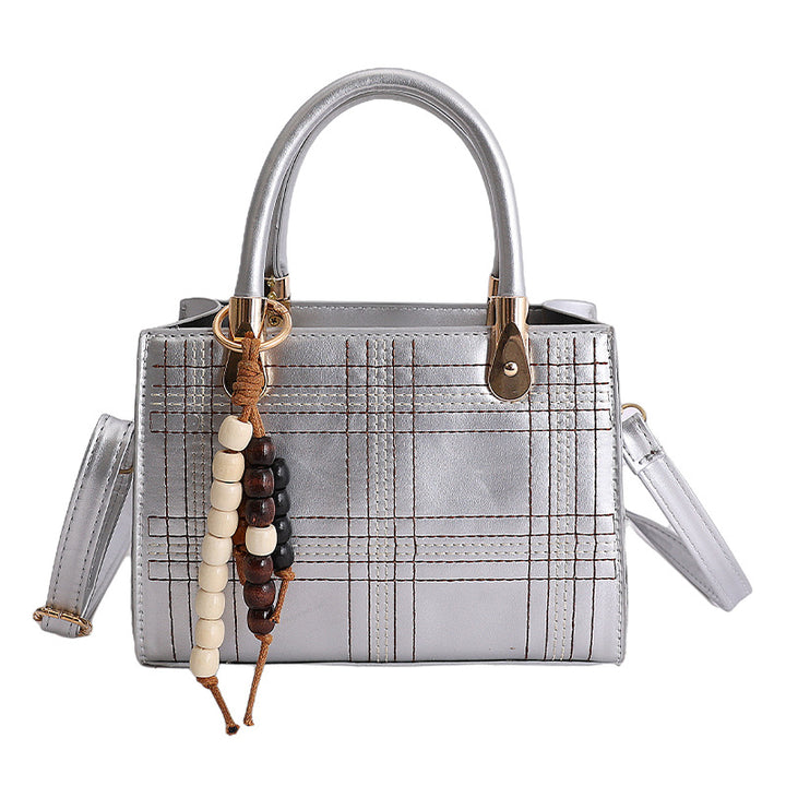 Damen Mini-Handtasche mit eleganter Struktur und goldenen Akzenten Nord Taschen