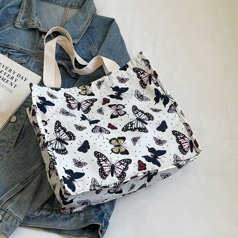 Damen Einkaufstasche mit floralem Schmetterlingsdesign und stabilen Tragegriffen Nord Taschen