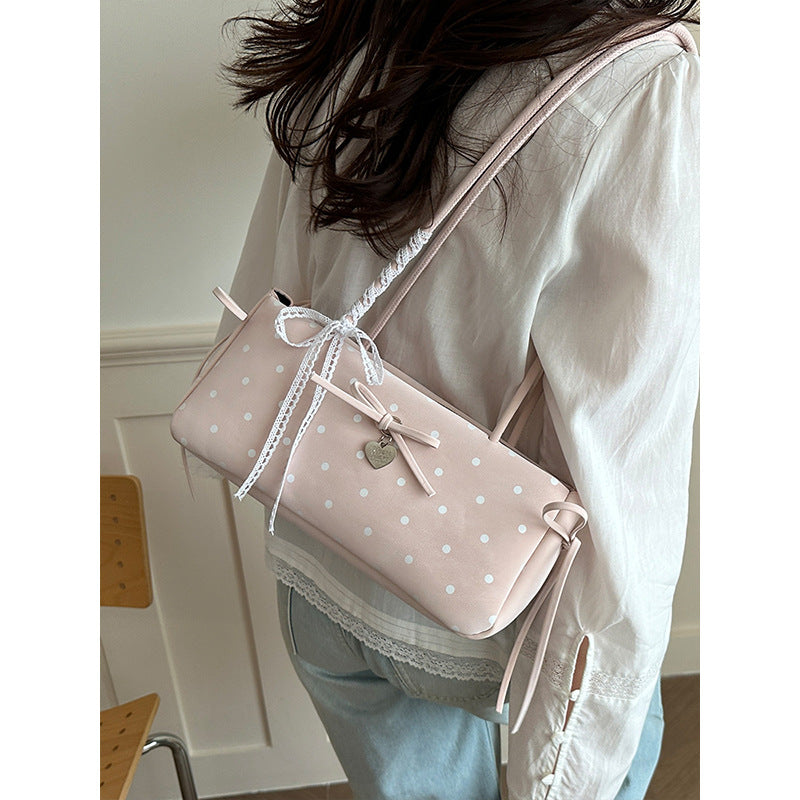Damen Handtasche mit spielerischem Punktemuster und eleganten Details Nord Taschen
