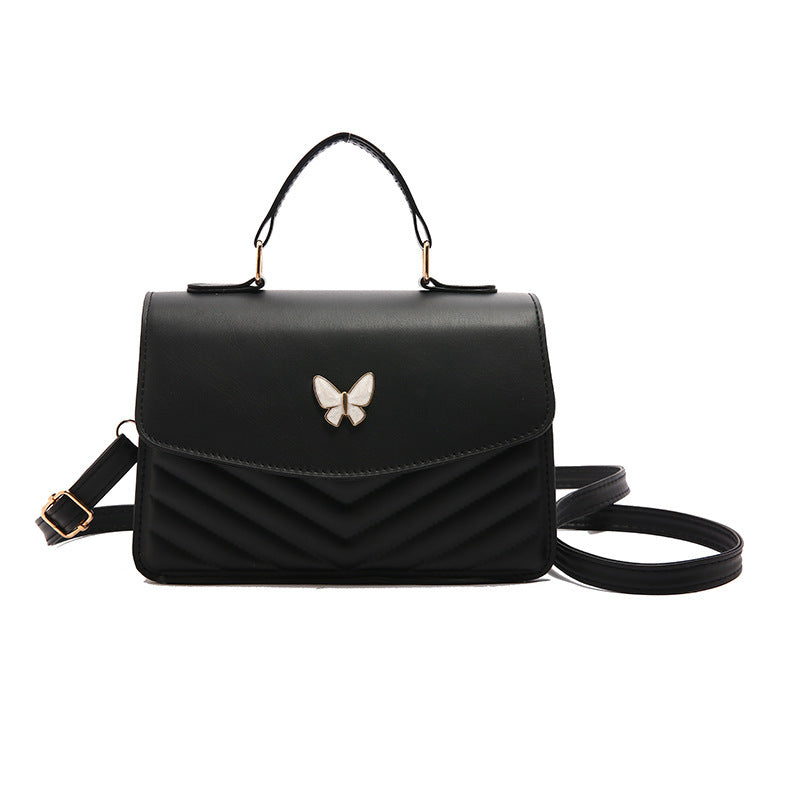 Damen stilvolle Umhängetasche mit geflochtenem Design und Schmetterlingsanhänger Nord Taschen