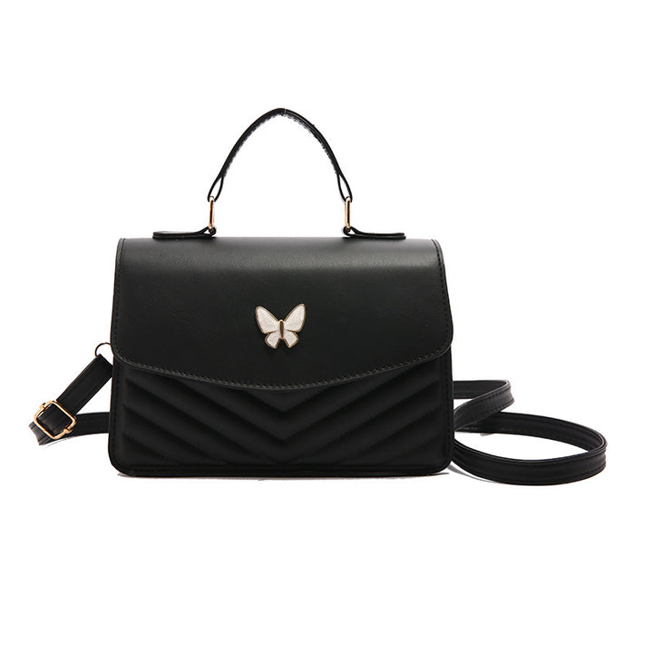 Damen stilvolle Umhängetasche mit geflochtenem Design und Schmetterlingsanhänger Nord Taschen