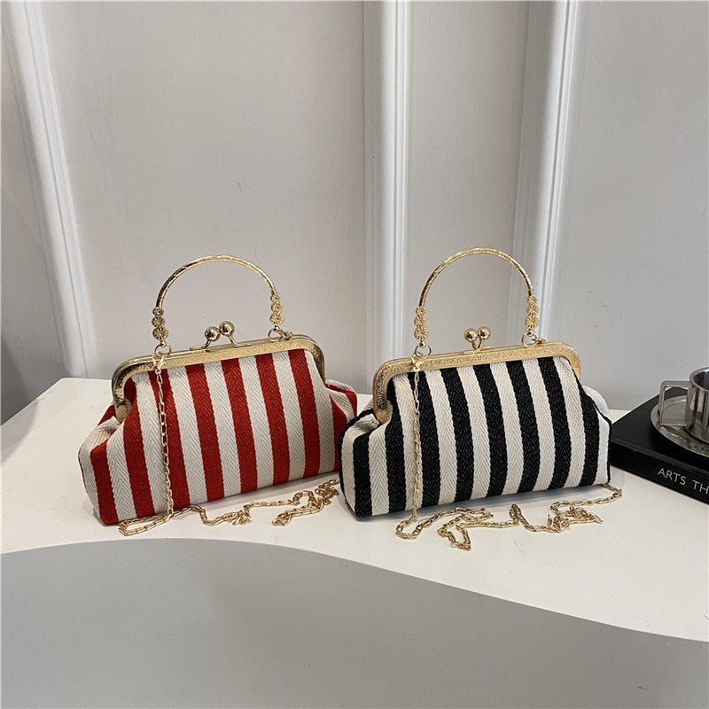 Damen Handtasche mit gestreiftem Design und goldenen Akzenten Nord Taschen