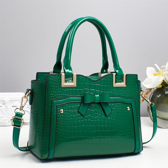 Damen elegante Handtasche mit dekorativem Schleifen-Detail und strukturiertem Krokodil-Leder-Look Nord Taschen