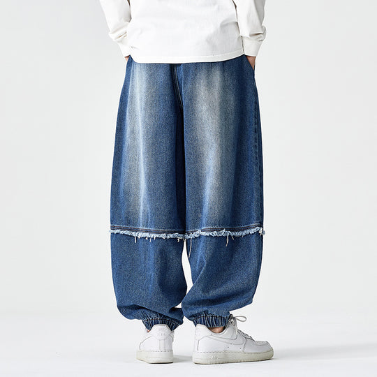Herren Weit geschnittene Baggy-Denim-Hose mit Tunnelzug, elastischen Beinabschlüssen und Fransen-Detail Nord Taschen