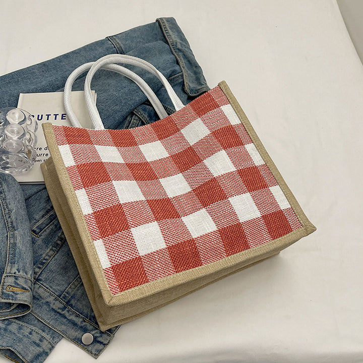 Damen Jute Tragetasche mit stilvollem Karomuster und verspieltem Pompon Nord Taschen