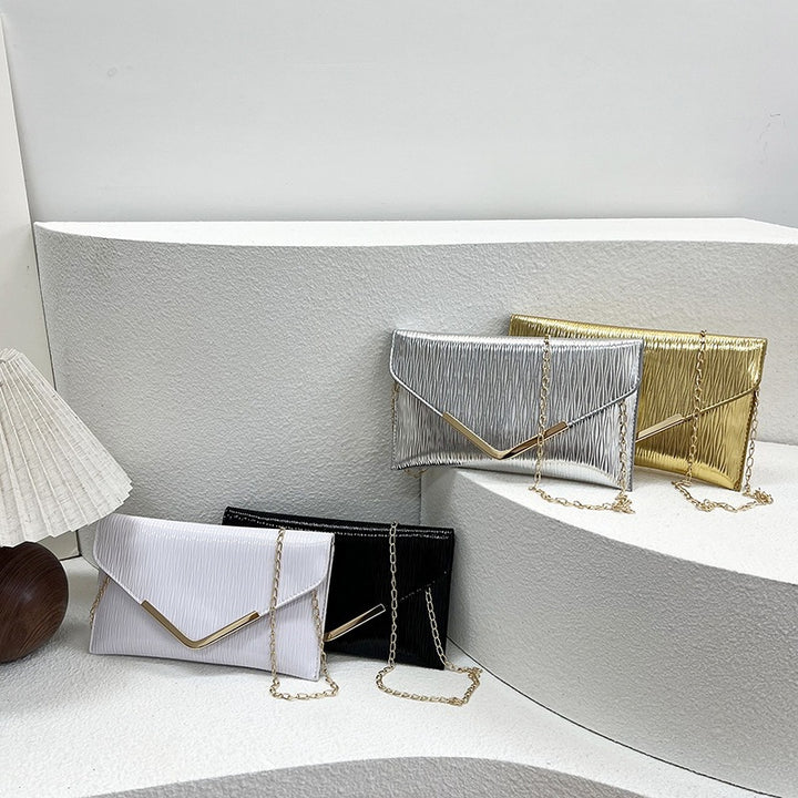 Damen elegante Clutch mit strukturiertem Obermaterial und goldenen Akzenten Nord Taschen