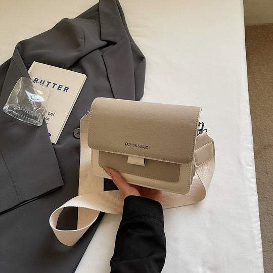 Damen Umhängetasche mit innovativem Klappverschluss und hochwertigen Akzenten Nord Taschen