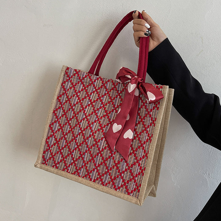 Damen Jute-Einkaufstasche mit buntem Grafikdesign und dekorativem Schleifenakzent Nord Taschen