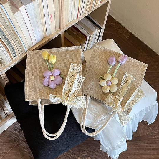 Damen Jute-Handtasche mit floralen Applikationen und dekorativem Schleifen-Design Nord Taschen