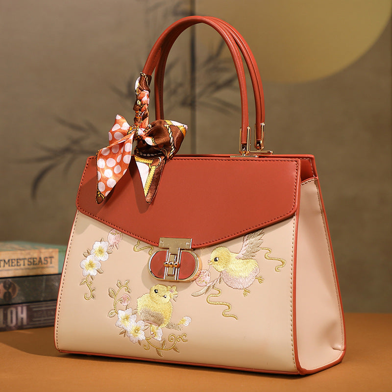 Damen Handtasche mit floraler Stickerei und modischem Schal Nord Taschen