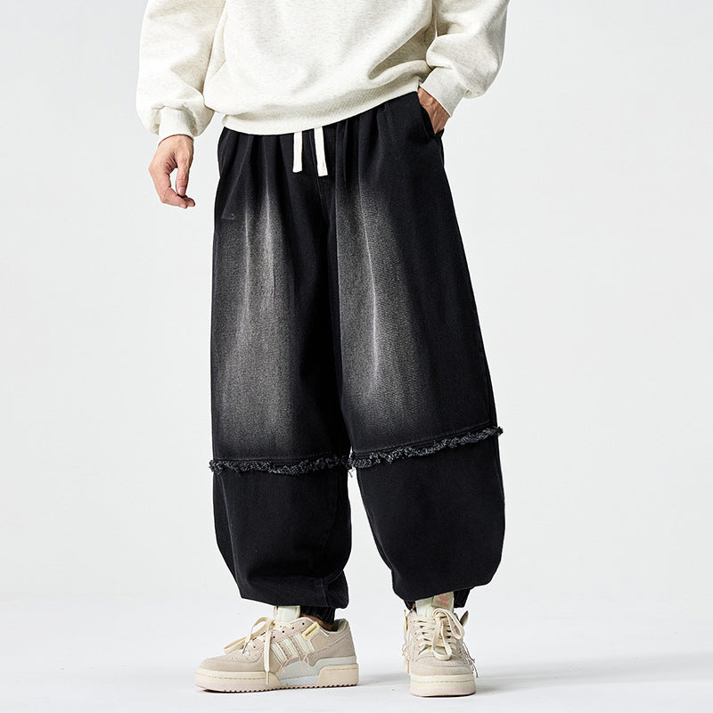 Herren Weit geschnittene Baggy-Denim-Hose mit Tunnelzug, elastischen Beinabschlüssen und Fransen-Detail Nord Taschen