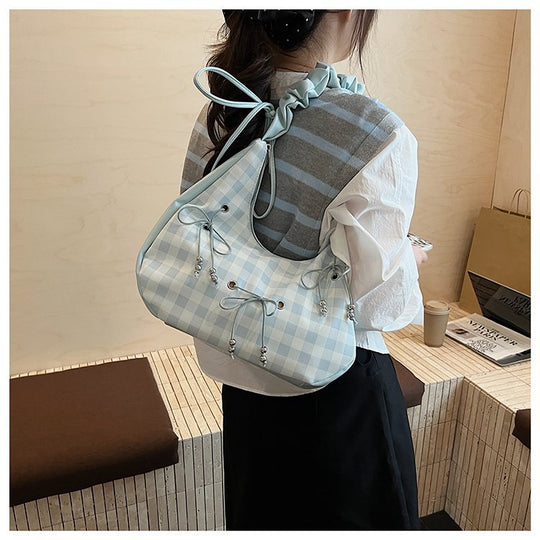 Damen Hobo-Tasche mit dekorativem Kordelzug und glänzenden Akzenten Nord Taschen