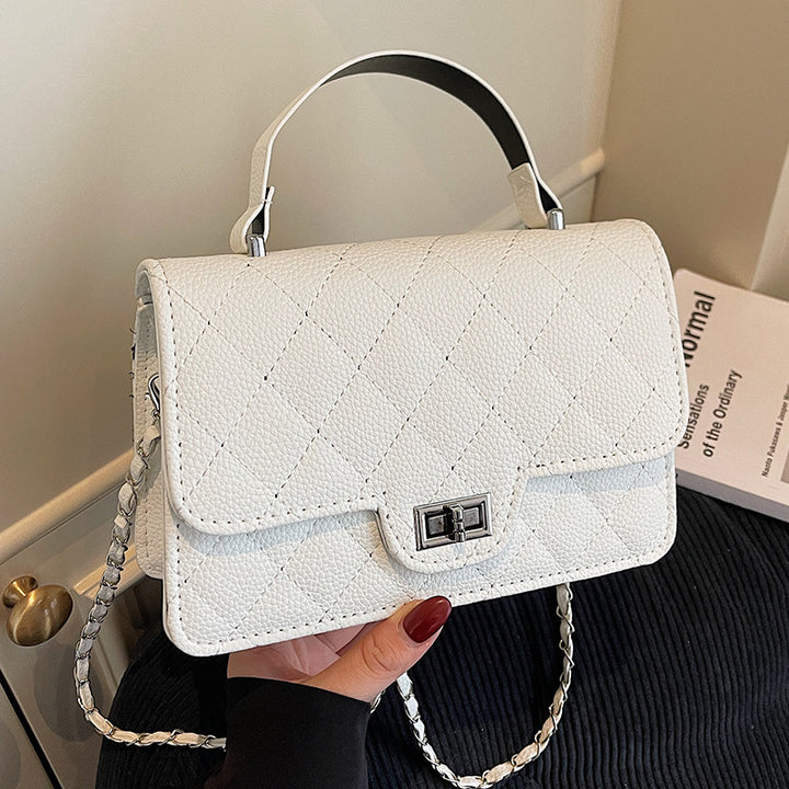Damen Handtasche mit eleganter Steppung und schickem Metallverschluss Nord Taschen