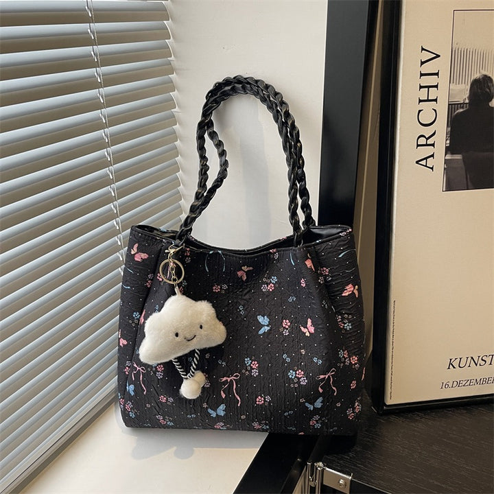 Damen modische Handtasche mit blumigem Design und verspieltem Anhänger Nord Taschen