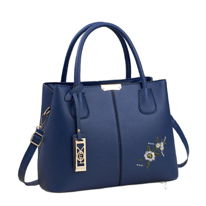 Damen Umhängetasche mit floralem Stickdesign und abnehmbarer Quaste Nord Taschen