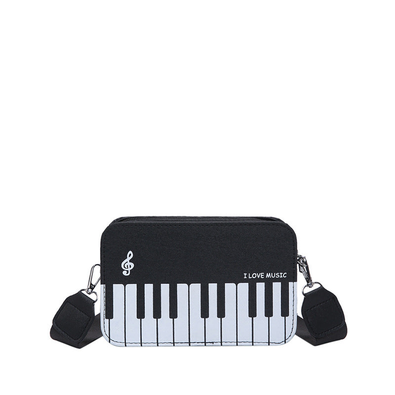 Damen Umhängetasche mit musikalischem Klaviertastendesign Nord Taschen