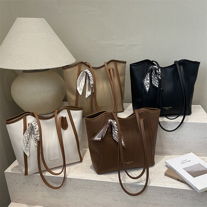 Damen elegante Handtasche mit modischem Schalszierring Nord Taschen