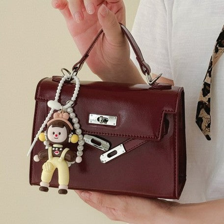 Damen Mini Handtasche mit süßem Anhänger Nord Taschen