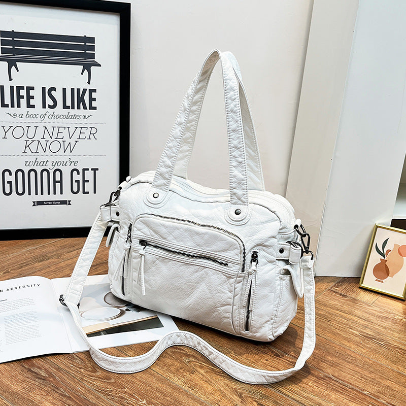 Damen Handtasche mit strukturiertem Design und dekorativen Metallakzenten Nord Taschen