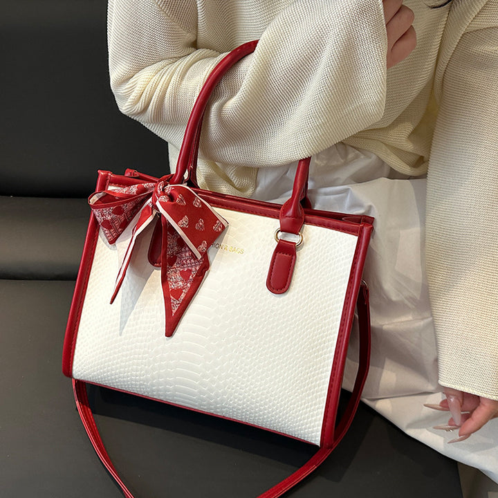 Damen stilvolle Handtasche mit geflochtenem Design und dekorativem Schleifenband Nord Taschen